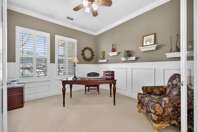 a bedroom with bed and a chandelier