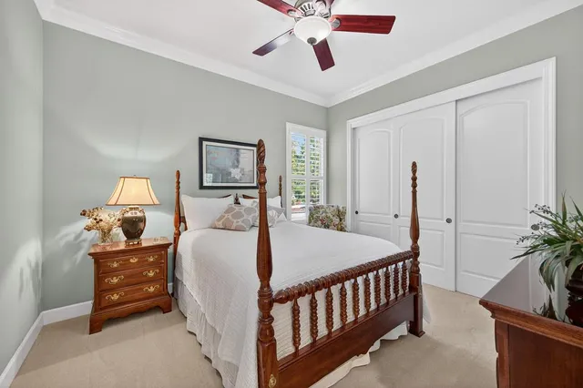 a spacious bedroom with a bed and a window