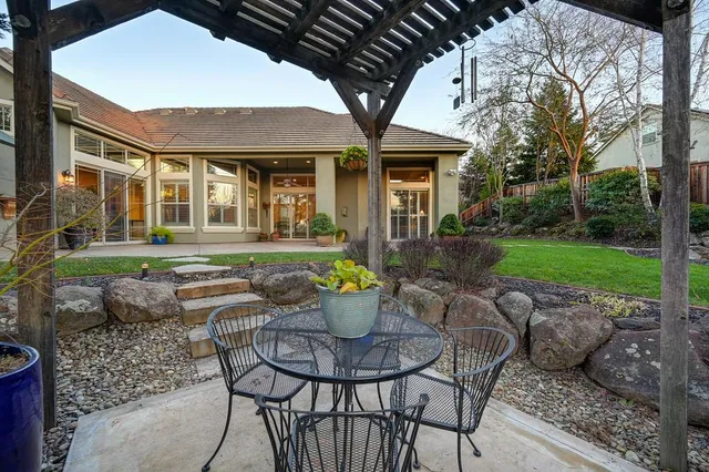 an aerial view of a house with outdoor space