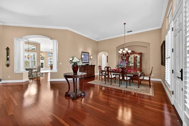 a view of a dining room with furniture window and wooden floor