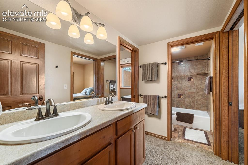 131 Paradiso Road Divide, CO 80814 - Photo 34 of 50 a bathroom with a sink a vanity and a mirror