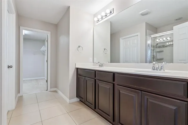 a bathroom with a glass shower door
