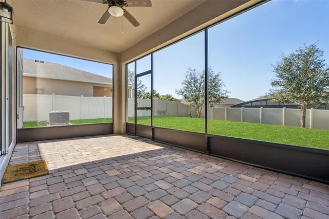 a view of a hallway with a chandelier and entryway