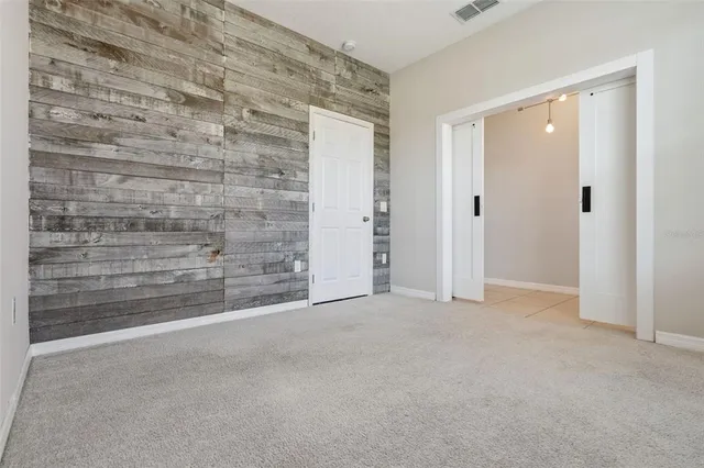 a view of an empty room and an entryway