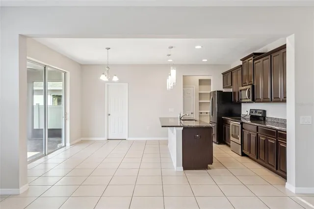 a large kitchen with cabinets