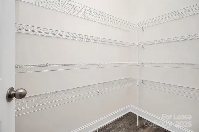 a view of a room with racks on the wall