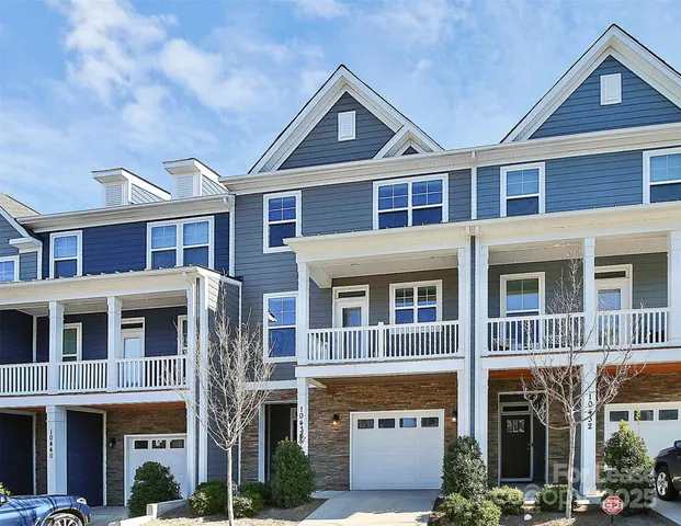 a front view of a building with large windows