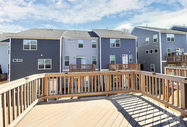 a view of a brick building next to a yard