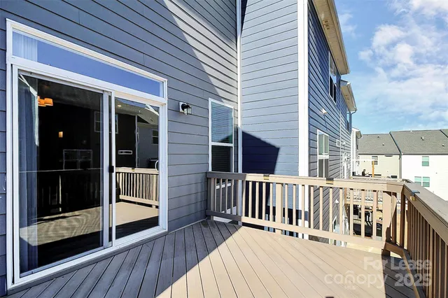 a view of a deck with wooden floor and fence