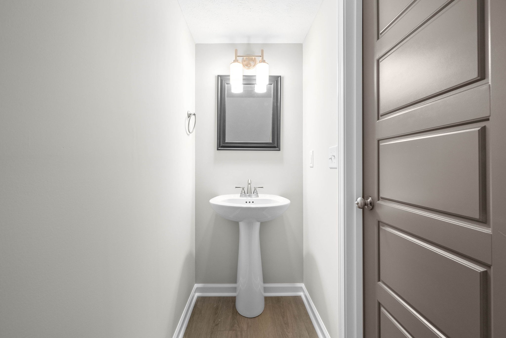 319 Longshadow Trail, Unit A Clarksville, TN 37043 - Photo 15 of 29 a bathroom with a sink and mirror
