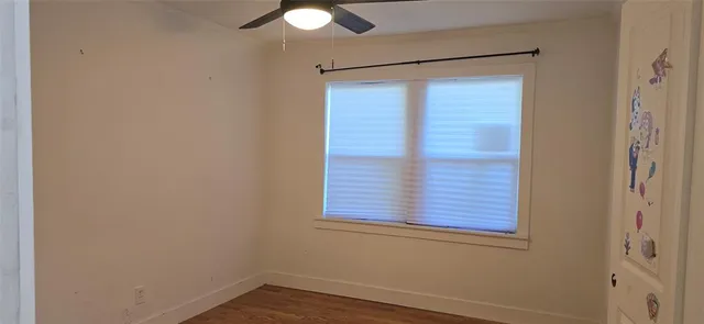a bathroom with a granite countertop toilet a sink and a mirror