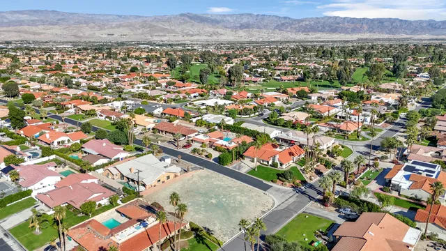 an aerial view of a city with lots of residential buildings