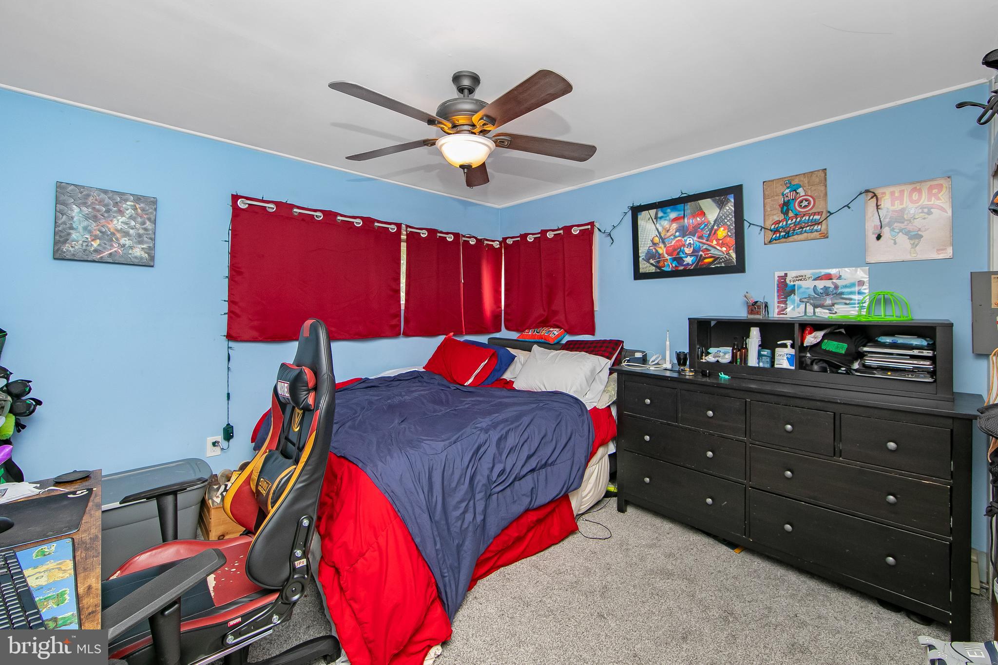 24 Grapevine Road Levittown, PA 19057 - Photo 26 of 39 a bed room with a bed and a chandelier