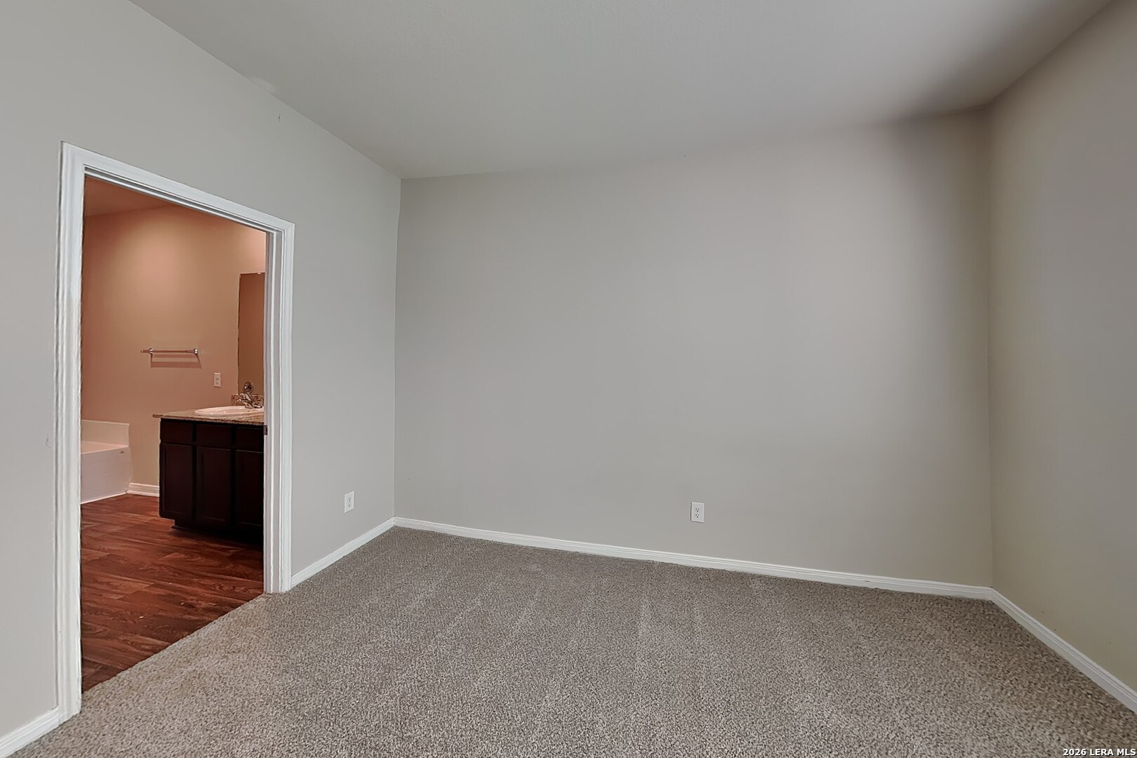 3022 Citron Garden Converse, TX 78109 - Photo 5 of 21 a view of an empty room and closet with wooden floor