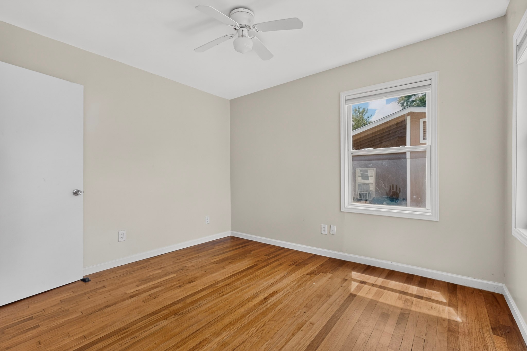 4711 Alf Avenue Austin, TX 78721 - Photo 26 of 34 BR2 - Hardwood flooring, multiple windows for abundant natural light, and a half bath