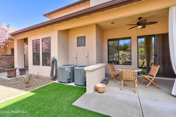 a view of an house with backyard porch and furniture