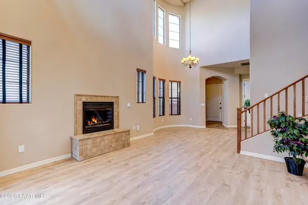 a view of a hallway with a fireplace and a potted plant