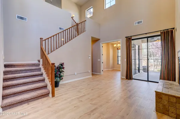 a view of an entryway with wooden floor and windows