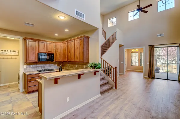 a kitchen with stainless steel appliances a stove a sink dishwasher and a refrigerator