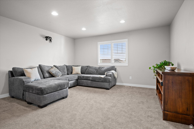 3359 Eurasian Crane Road Clinton, UT 84015 - Photo 27 of 71 Living room with light carpet and recessed lighting
