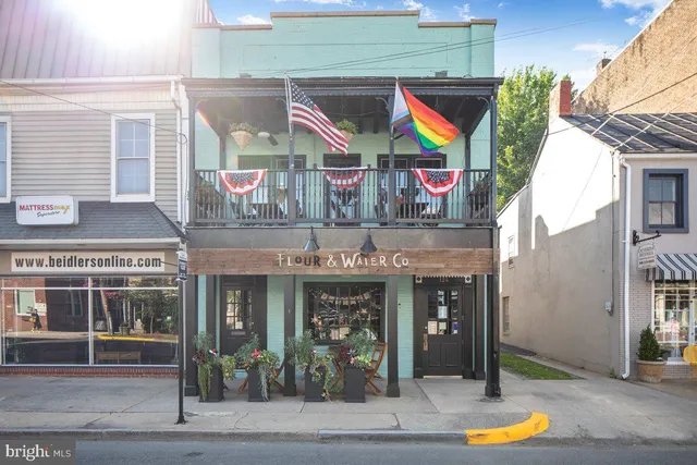 a front view of a building with basket ball court