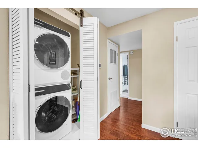 a view of a hallway with washer and dryer