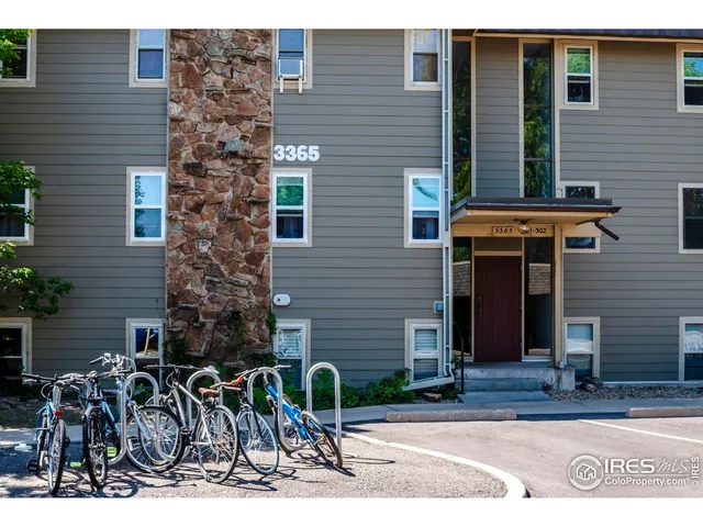 a front view of a building with garden