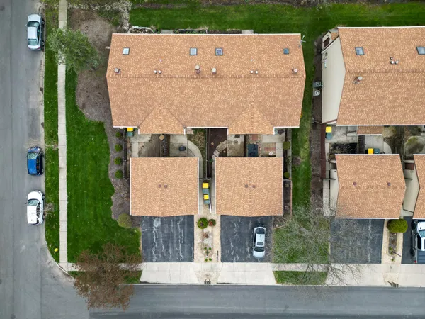 an aerial view of residential houses with outdoor space