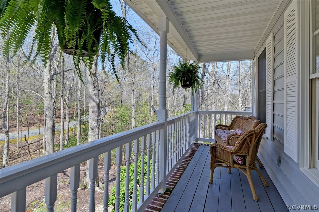 110 Westminster Place Williamsburg, VA 23188 - Photo 18 of 50 a view of a balcony with furniture and wooden floor