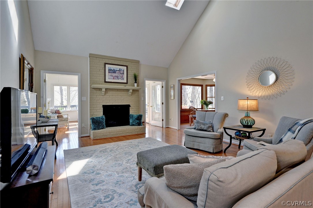 110 Westminster Place Williamsburg, VA 23188 - Photo 21 of 50 a living room with furniture a fireplace and a flat screen tv