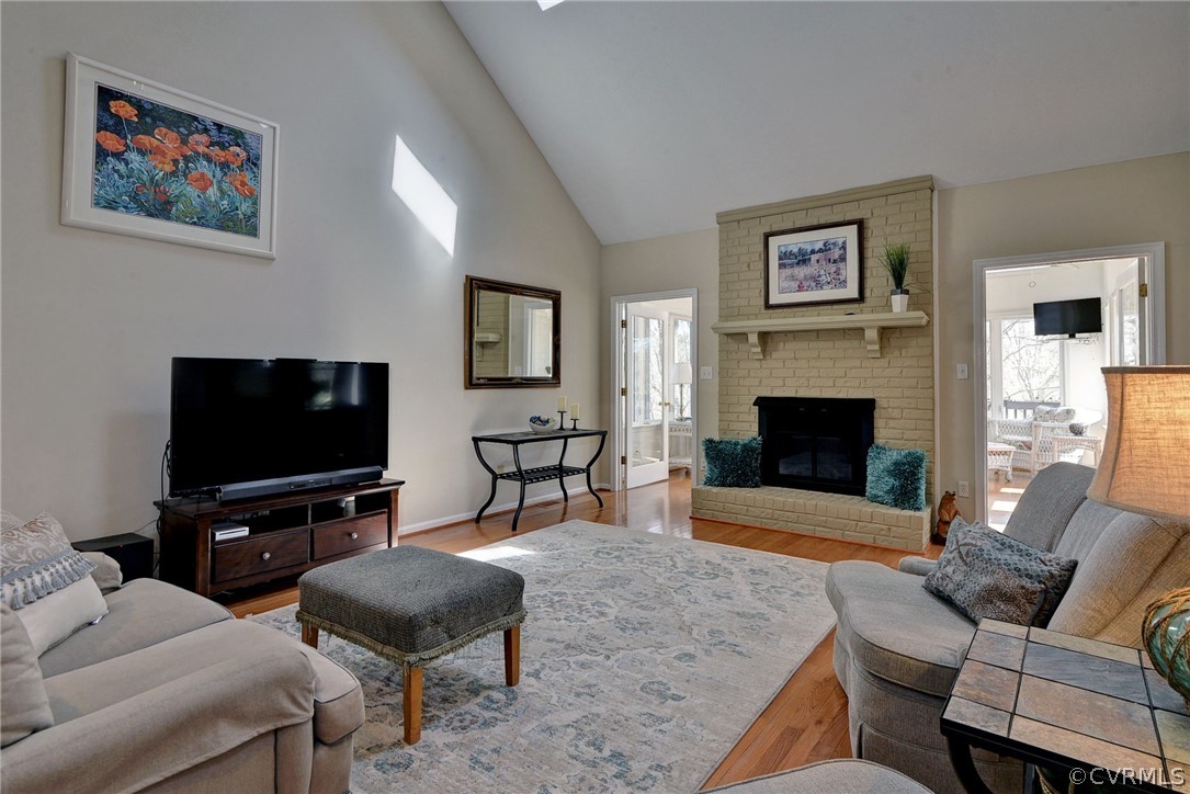 110 Westminster Place Williamsburg, VA 23188 - Photo 22 of 50 a living room with furniture a flat screen tv and a fireplace