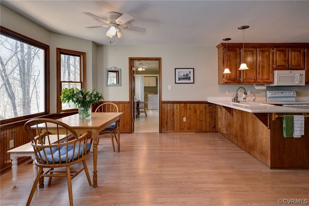 110 Westminster Place Williamsburg, VA 23188 - Photo 26 of 50 a living room with dining room furniture and a wooden floor