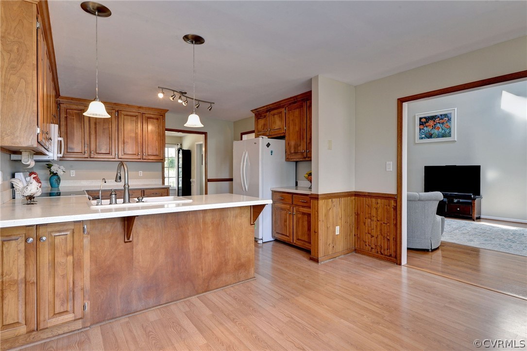 110 Westminster Place Williamsburg, VA 23188 - Photo 29 of 50 a large white kitchen with wooden floor and a sink