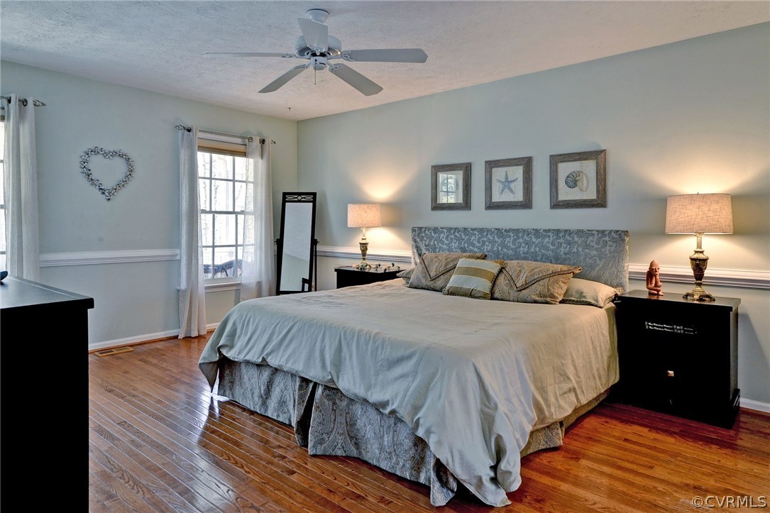 110 Westminster Place Williamsburg, VA 23188 - Photo 38 of 50 a bedroom with a bed and wooden floor