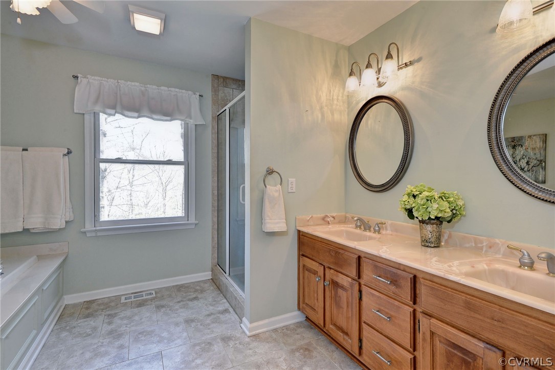 110 Westminster Place Williamsburg, VA 23188 - Photo 41 of 50 a bathroom with a double vanity sink and a mirror