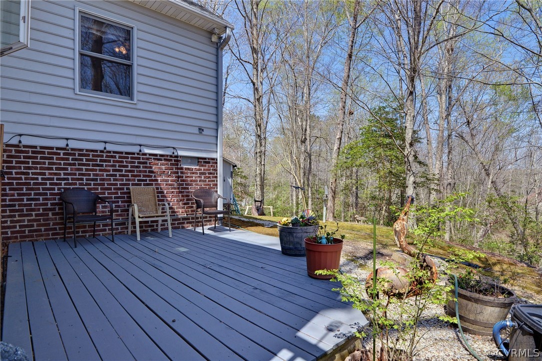 110 Westminster Place Williamsburg, VA 23188 - Photo 6 of 50 a view of a chairs and table on the wooden deck