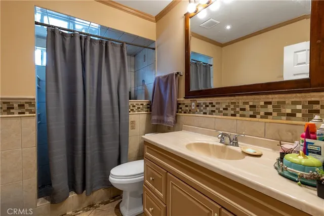 a dining table chair next to a window