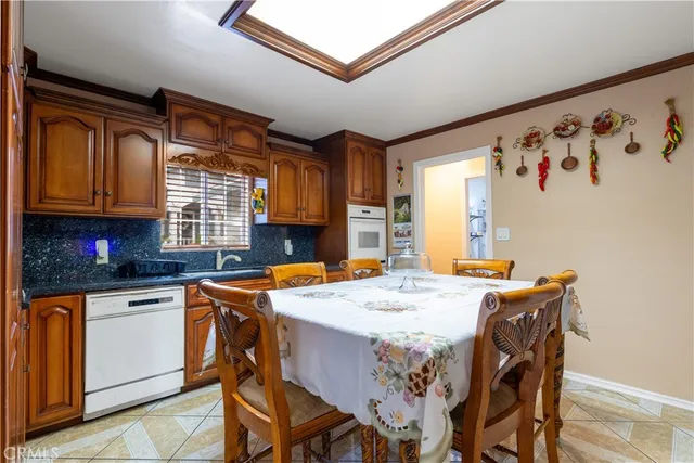 a view of a dining room with furniture and window