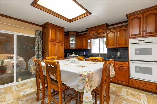 a bathroom with a sink and mirror with toilet