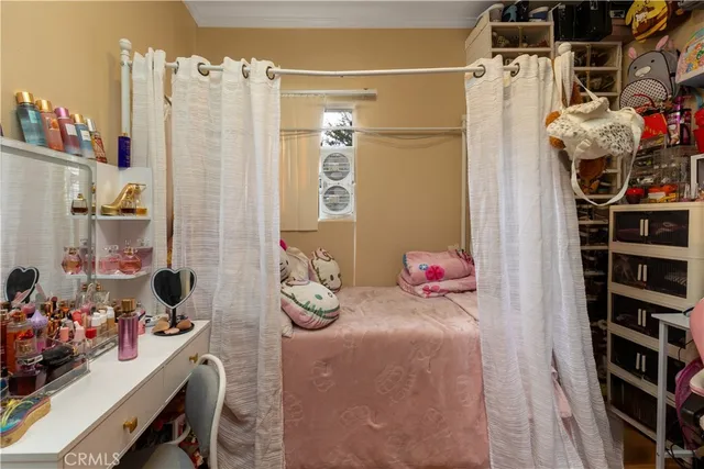 a bed room with furniture and a window