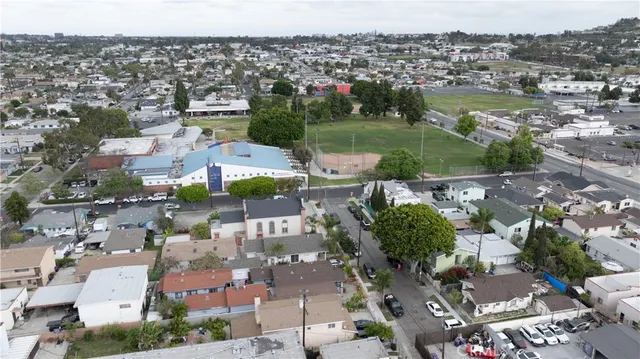 a lobby with furniture and potted plants