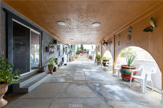 a lobby with furniture and potted plants