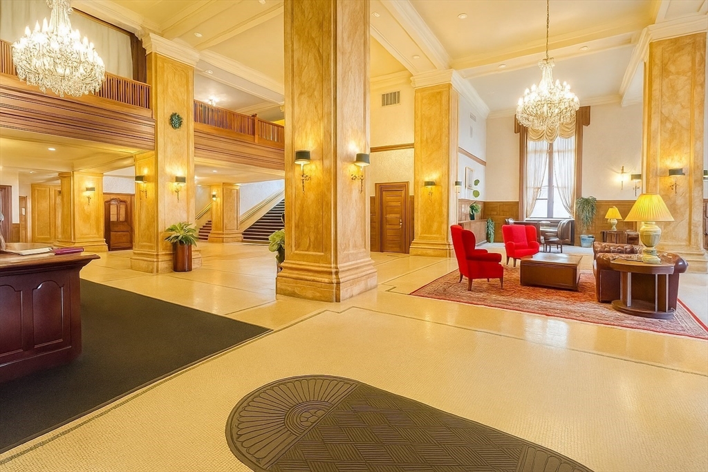 140 Chestnut Street, Unit 709 Springfield, MA 01103 - Photo 14 of 18 a lobby with furniture and floor to ceiling windows