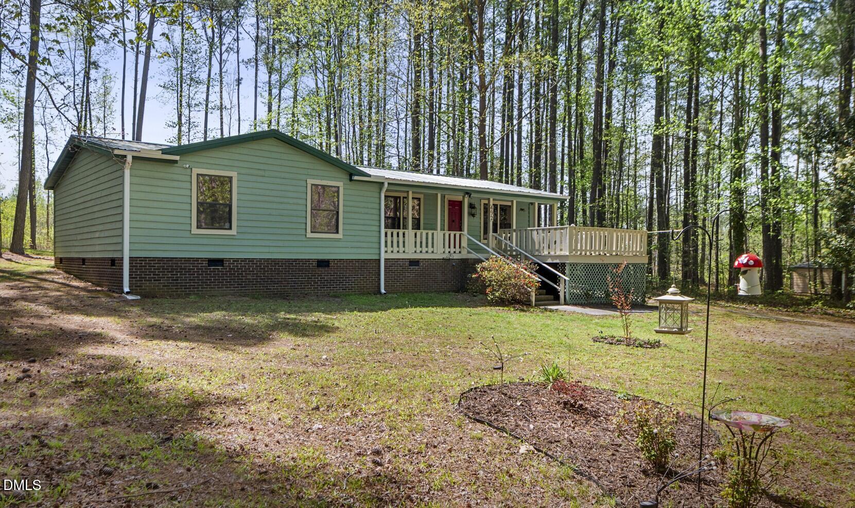 492 Little Mill Road Henderson, NC 27537 - Photo 2 of 39 a view of a house with backyard