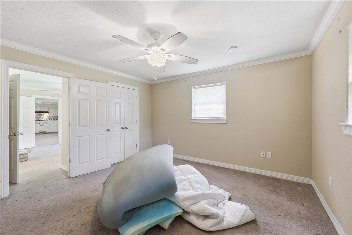 150 Gary Street Bridge City, TX 77611 - Photo 8 of 12 Bedroom with closet space and natural lighting.