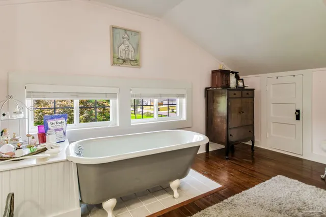 a view of a house with a yard porch and sitting area