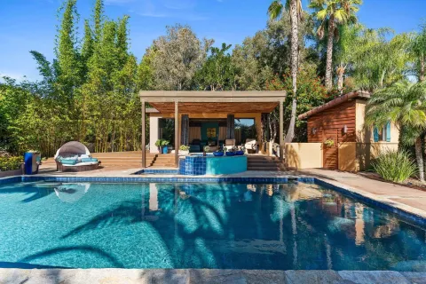a view of a swimming pool with a patio