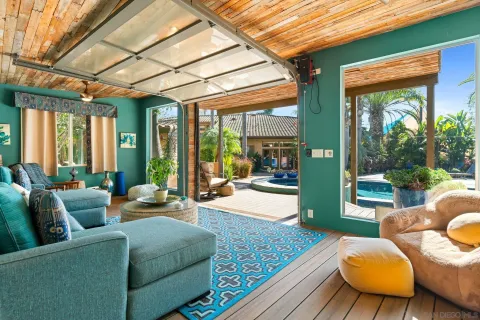 a balcony with furniture and a garden