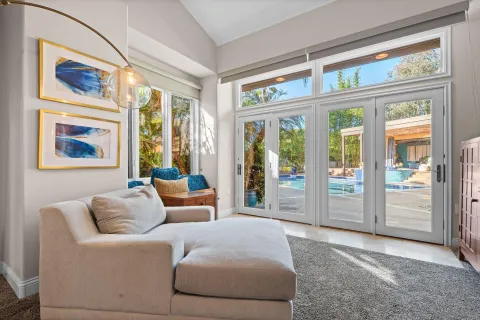 a living room with furniture and a large window