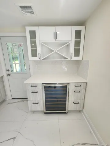 a view of an empty room with a fireplace